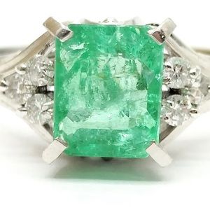 Emerald, diamond and platinum ring. 1.24 carat center stone.